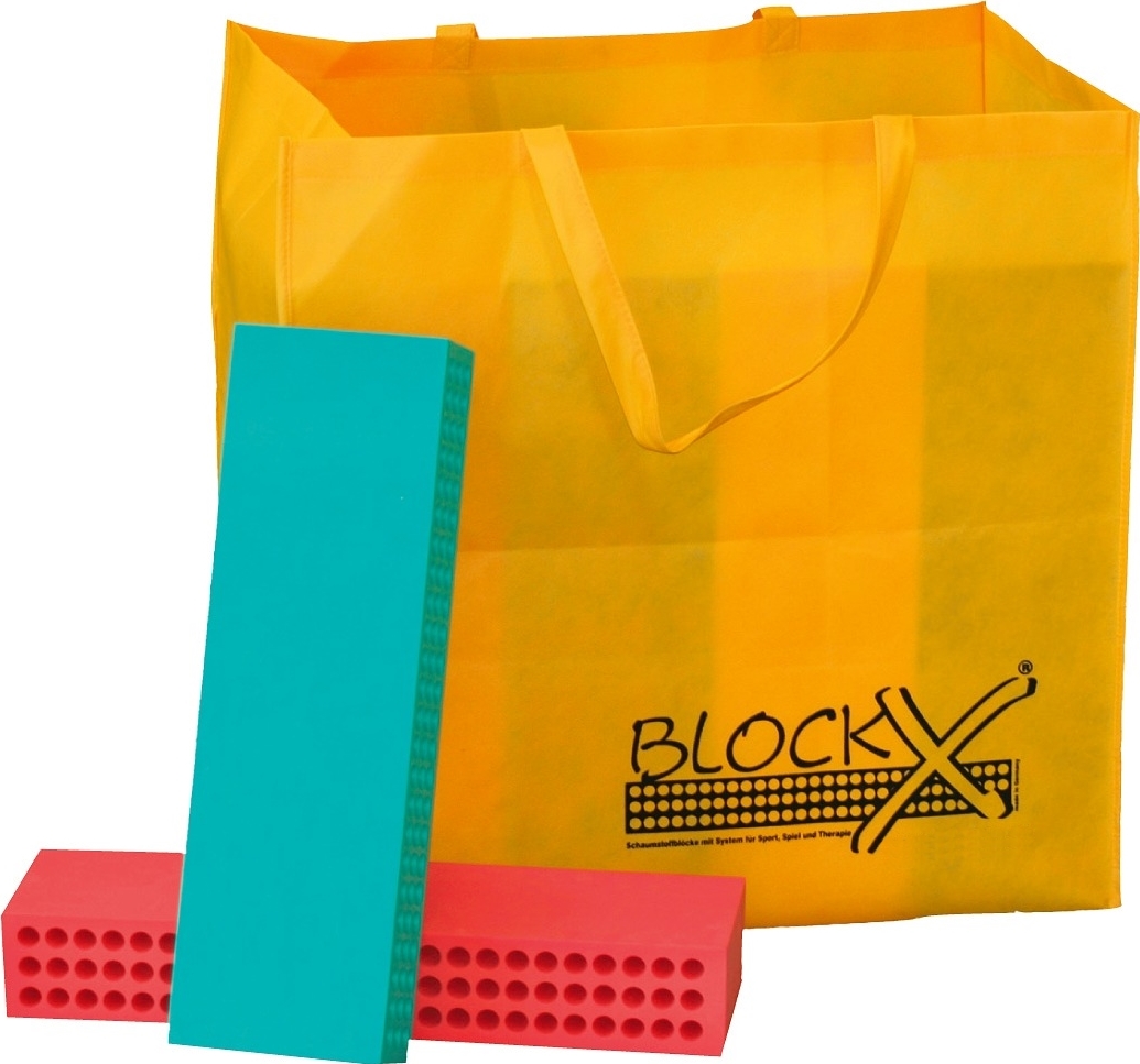 Ein gelber Beutel mit BlockX-Schaumstoffblöcken in Rot und Blau.